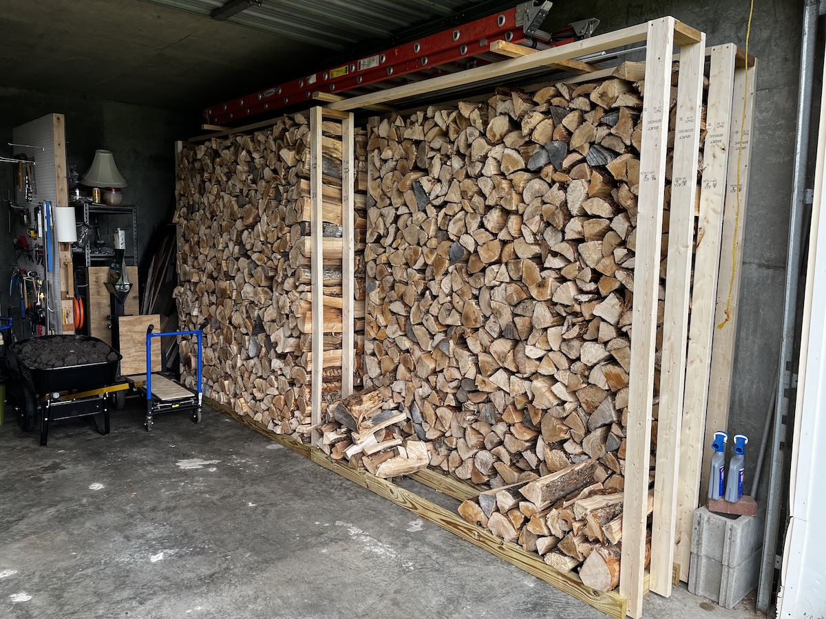 Two cords of firewood stacked into the rack