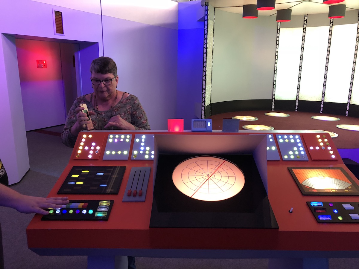 Marcia in the transporter room at the Star Trek Set Tour in Ticonderoga, NY.