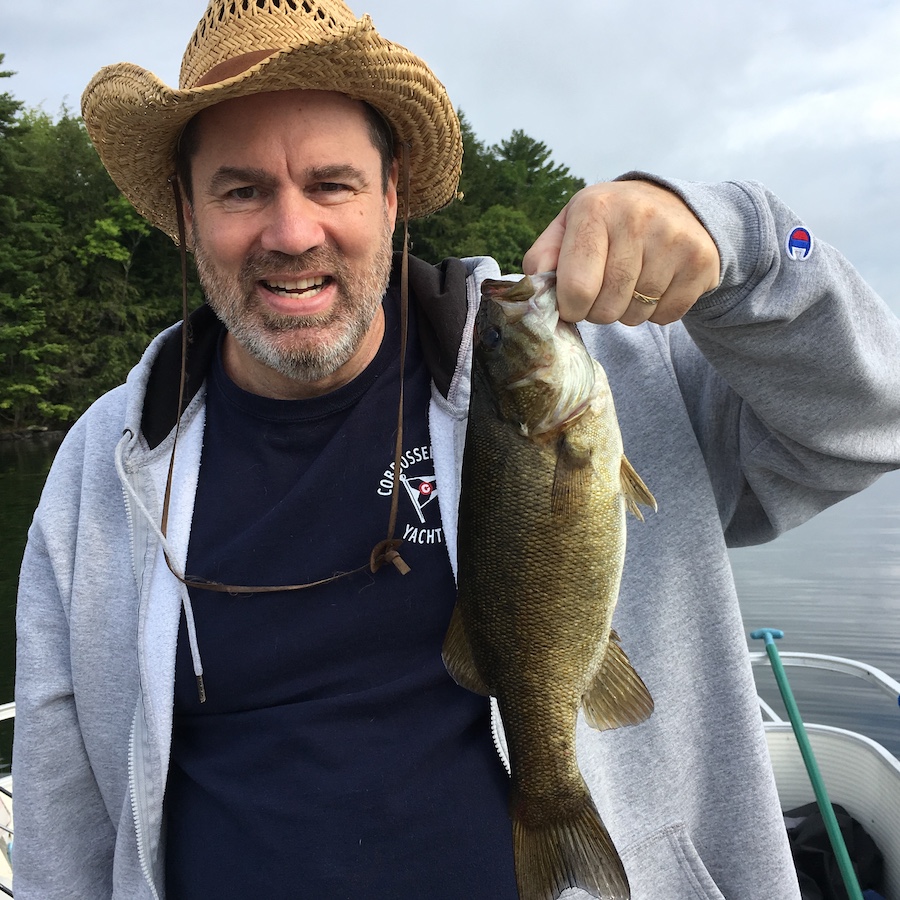 Brian captured a small mouth bass on Cobbosseecontee Lake in Maine. Caught, weighed and released.