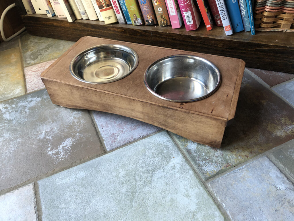 The new wooden dog dish holder I made in my woodshop for Lexi the rescue mutt.