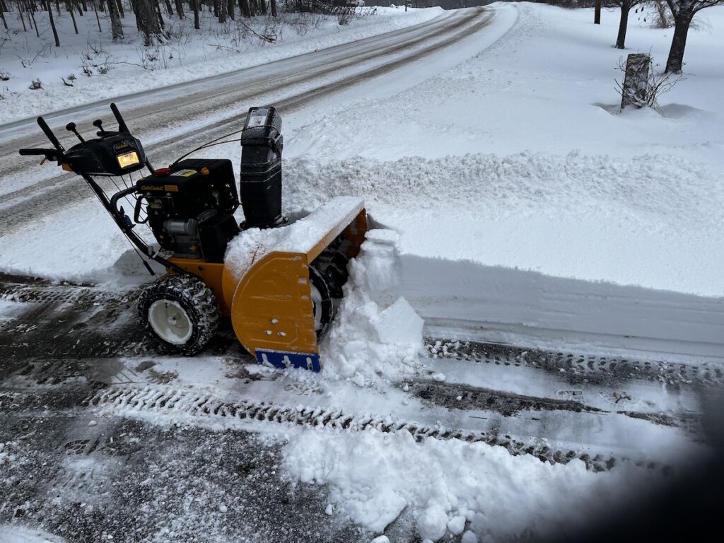 Snow thrower, still more work to do clearing snow from the driveway.